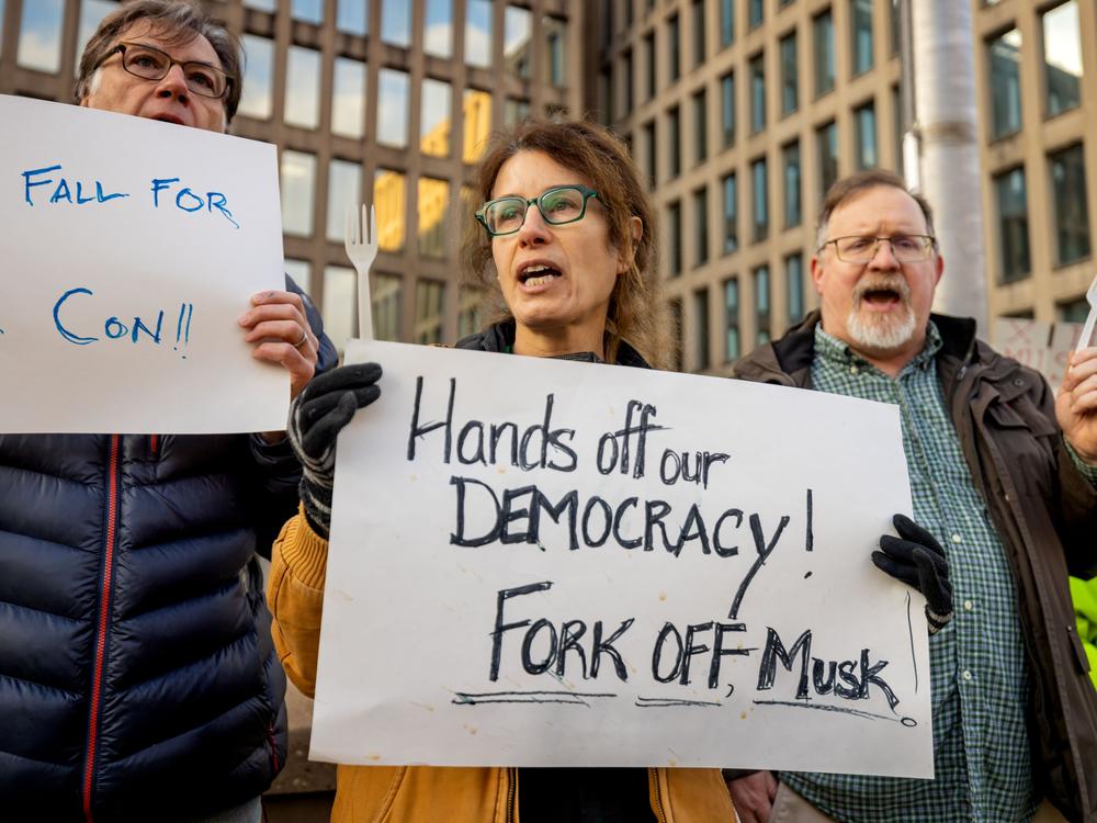Protesters gather outside the Office of Personnel Management headquarters in Washington, D.C., to protest Elon Musk's actions.