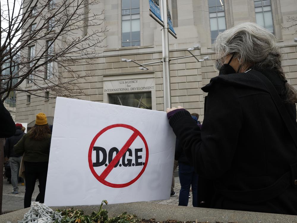 Protesters outside of the U.S. Agency for International Development headquarters on Feb. 3, 2025 in Washington, D.C. Elon Musk said in a social media post that he and President Trump will shut down the foreign assistance agency.
