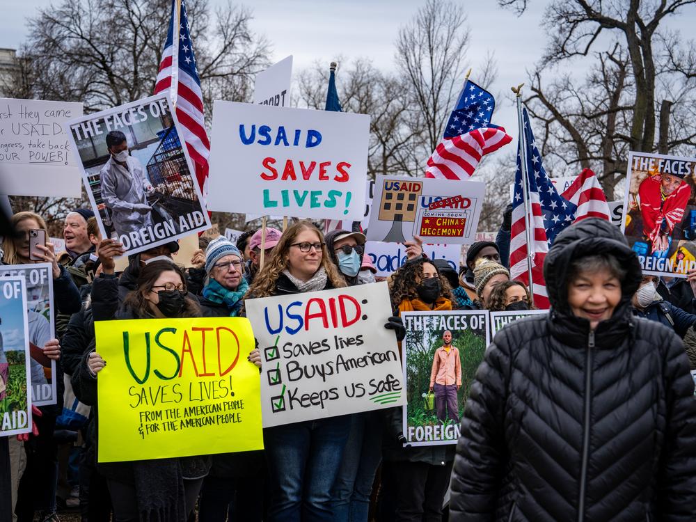 Hundreds of people gathered near the Capitol to protest the dismantling of USAID, the international agency charged with dispensing humanitarian aid around the world on behalf of the United States.