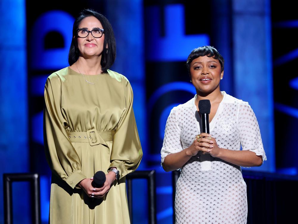 Aurora Barboza Flores and Quinta Brunson speak onstage during the FireAid benefit concert on Jan. 30, 2025.