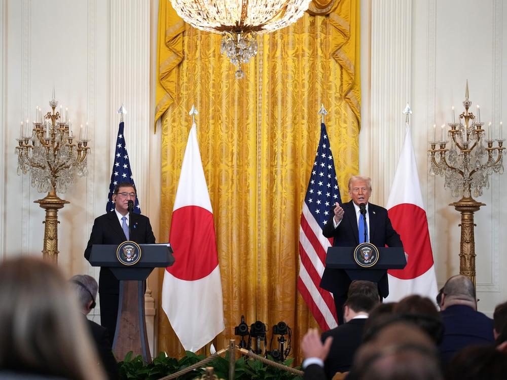 President Trump takes questions from the press alongside Japanese Prime Minister Shigeru Ishiba from the East Room of the White House on Friday.