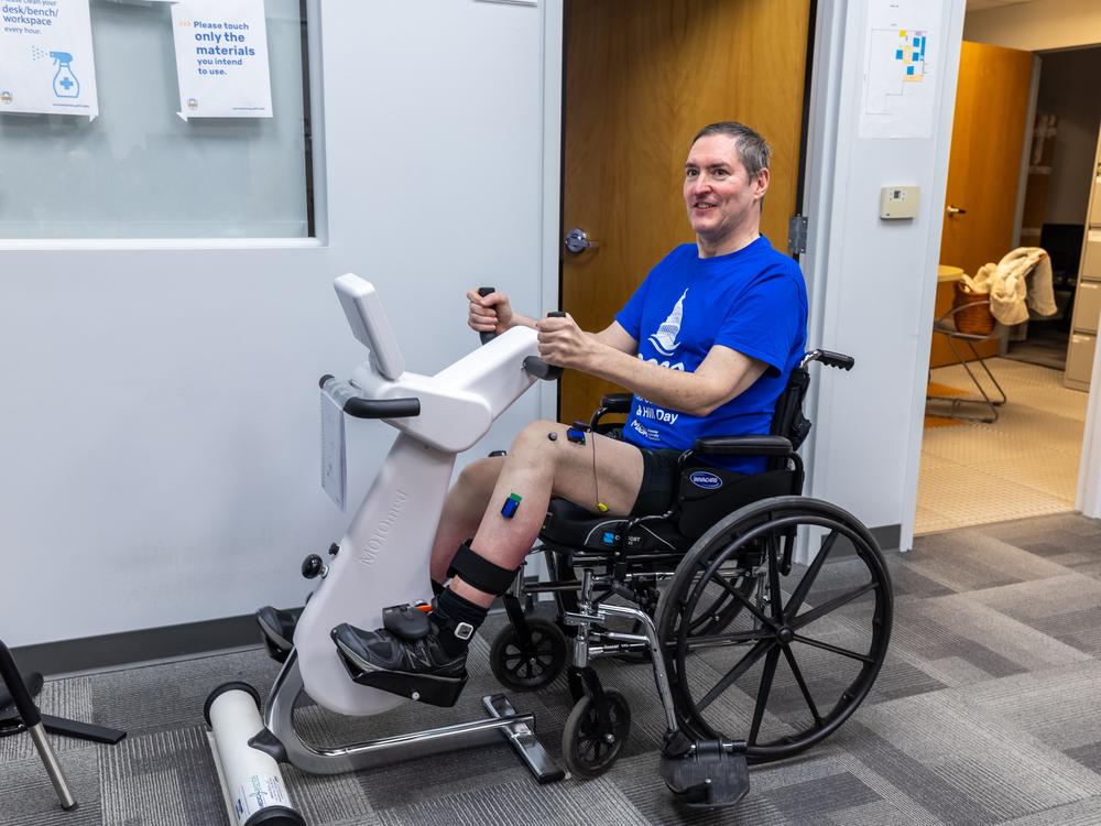 Research participant Doug McCullough uses the adaptive exercise bike during a testing session at the University of Pittsburgh.