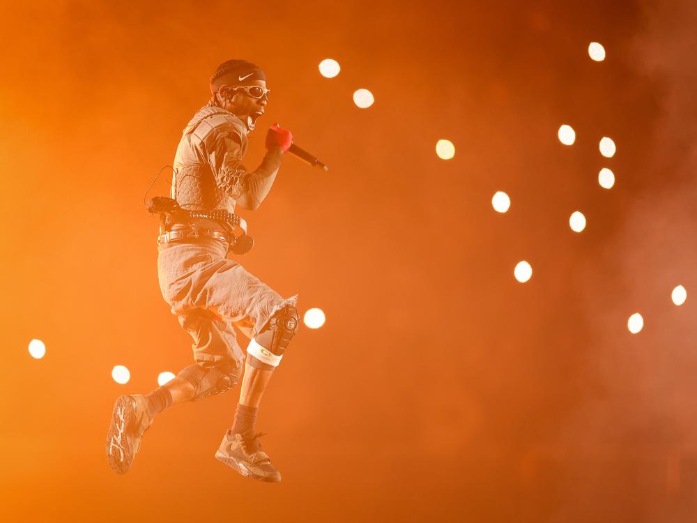 Travis Scott, seen here performing in the Netherlands in 2024, scored his fifth No. 1 pop hit this week with 