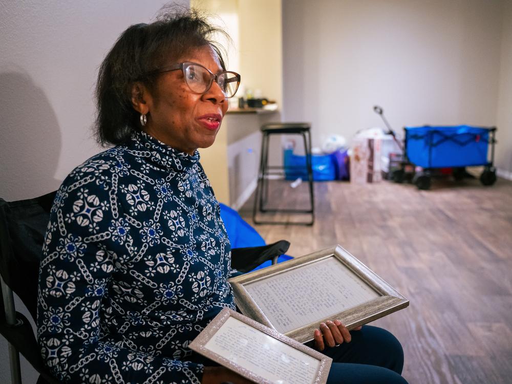 Aldra Allison holds letters that her children wrote to her, some of the only keepsakes she was able to salvage in the Eaton Fire that ravaged her Altadena home. The Eaton Fire was the deadliest and most destructive of the Los Angeles wildfires. She and her husband are staying in an apartment in Monrovia, Calif.