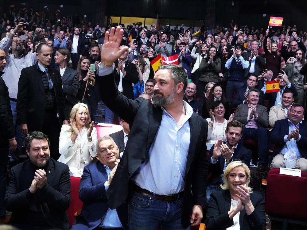 Spanish far-right VOX party leader Santiago Abascal, centre, waves next to European far-right politicians during the Patriots for Europe summit in Madrid, Spain, Saturday, Feb. 8, 2025. From left, Italy's vice Premier Matteo Salvini, Hungarian Prime Minister Viktor Orban, far-right VOX party leader Santiago Abascal and French far-right leader Marine Le Pen.