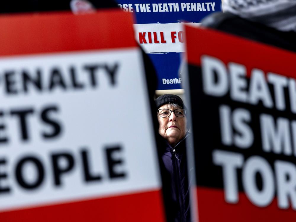 Michigan resident Beverly Leaf stands in solidarity with the mother of Demetrius Frazier as she pleads for Gov. Gretchen Whitmer to bring him to Michigan to serve out a life sentence.