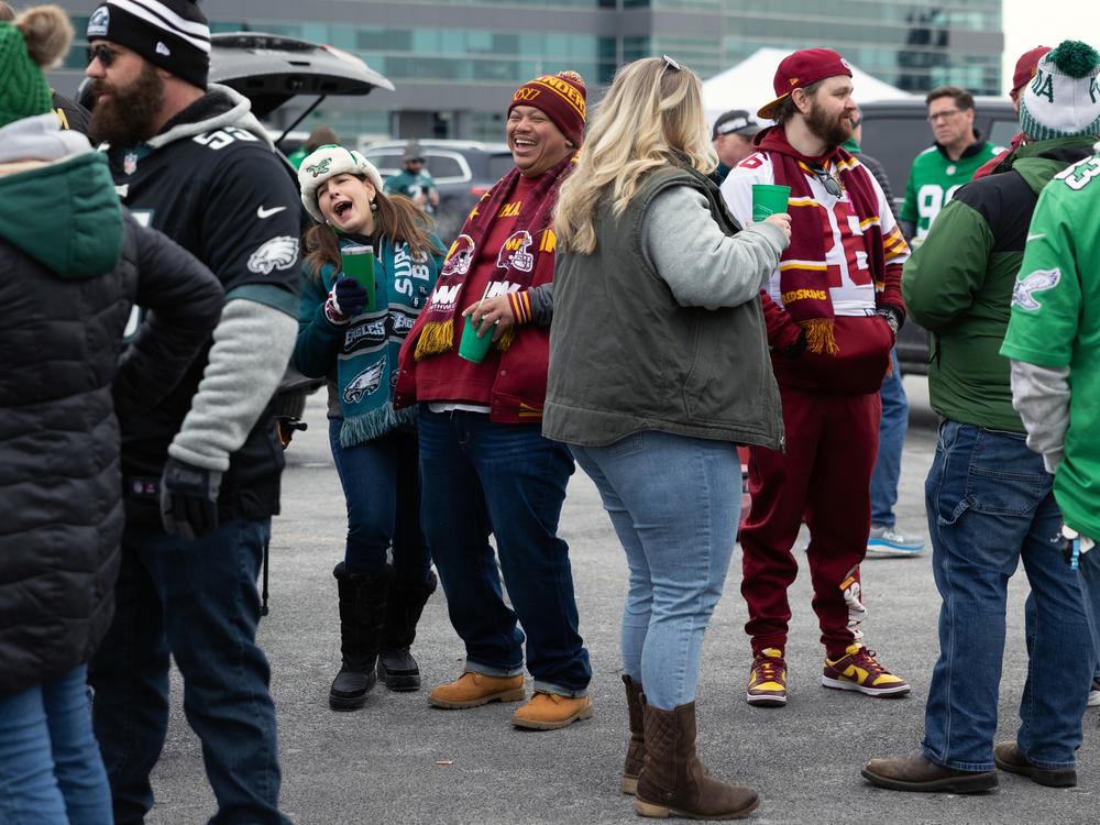 Philadelphia Eagles and Washington Commanders fans tailgate ahead of the NFC championship game which would send the Eagles to the Super Bowl.