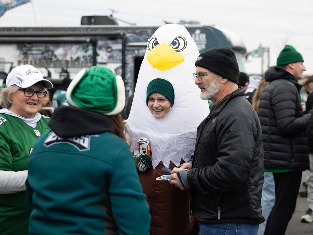 Susan Klabunde (center) dons an eagle costume at a tailgate before the NFC championship game at Lincoln Financial Field in Philadelphia.