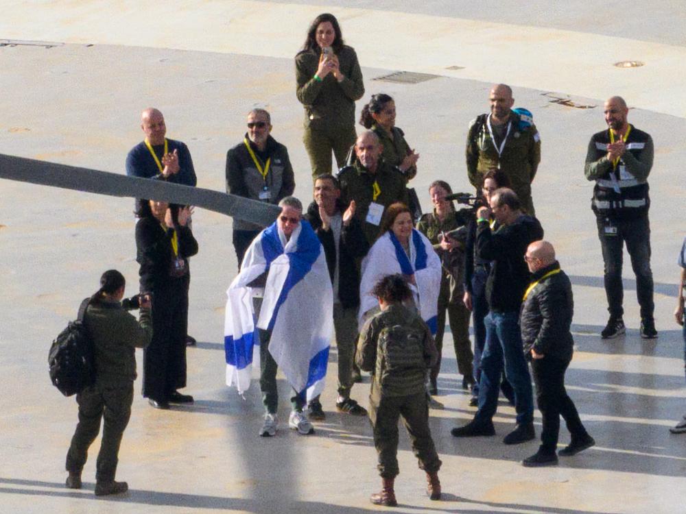 Released hostage Ohad Ben Ami draped in an Israeli flag arrives at Tel Aviv Sourasky Medical Center - Ichilov Hospital by helicopter, on Feb. 8, in Tel Aviv, Israel.