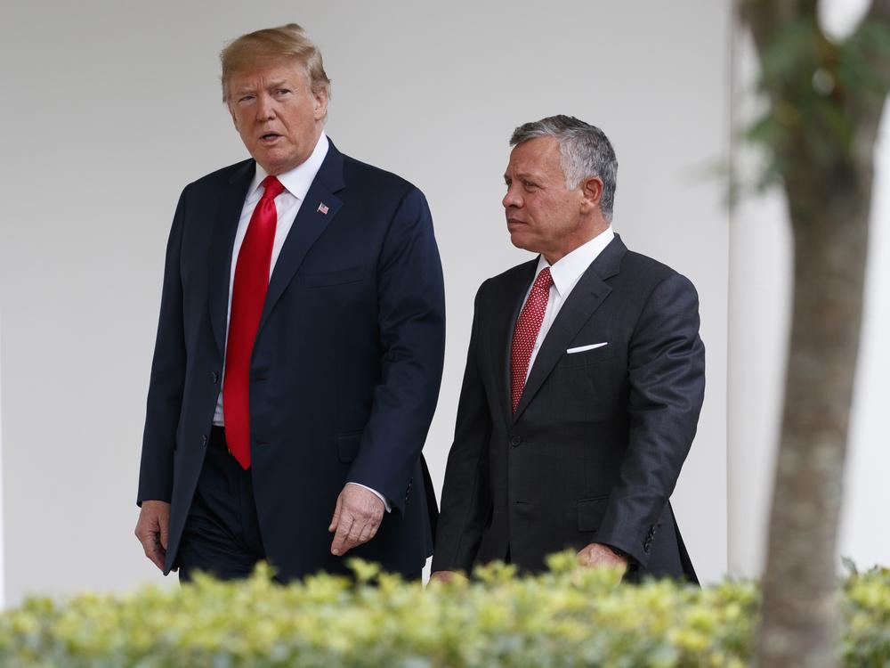 President Trump walks with King Abdullah II of Jordan at the White House, on June 25, 2018, in Washington.