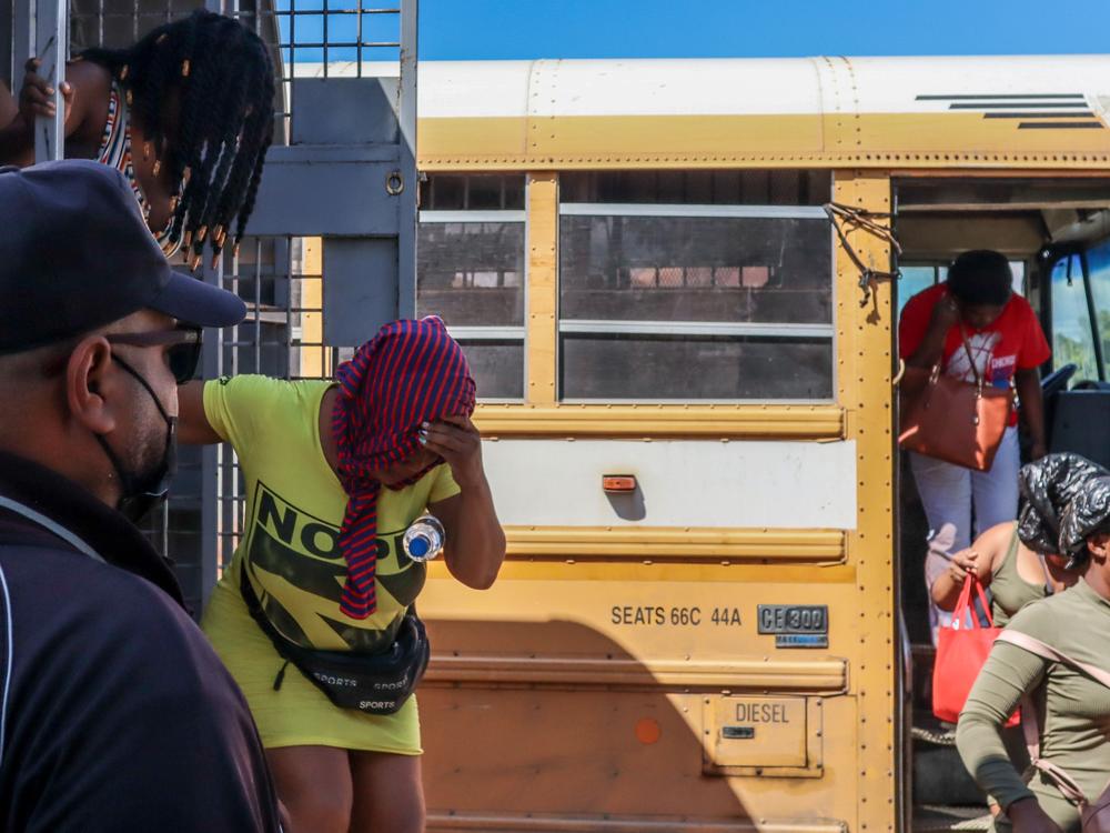 Haitians deported from the Dominican Republic get out of trucks in Carrizal, Dominican Republic, on the border with Haiti on Jan. 30.
