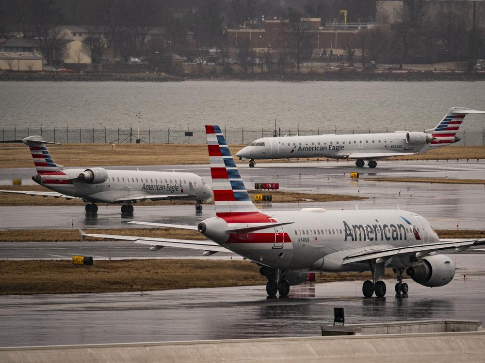 American Eagle and American Airlines planes taxi at the Ronald Reagan Washington National Airport, on February 6, 2025 in Arlington, Va. The Federal Aviation Administration has reopened two of the airport's runways following the January 29 mid-air collision between a U.S. Army Black Hawk helicopter and an American Airlines regional jet that was landing at DCA.