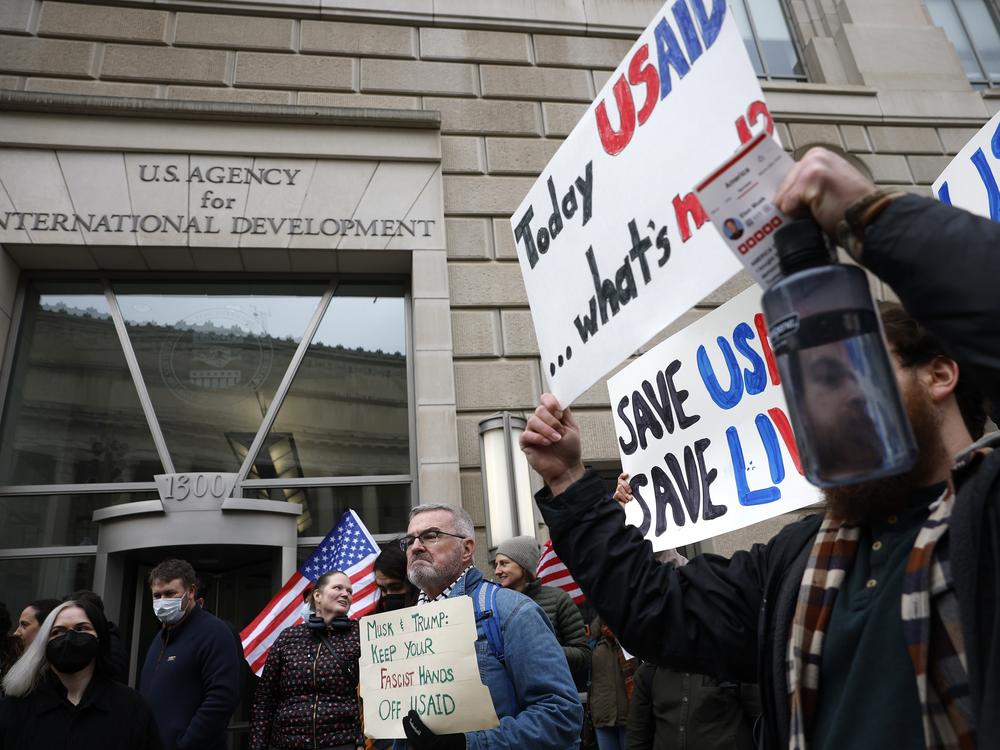 People gather to protest outside of the U.S. Agency for International Development (USAID) headquarters on Feb. 03, 2025 in Washington, D.C. Elon Musk, head of the Department of Government Efficiency (DOGE), said in a social media post that he and President Donald Trump will shut down the foreign assistance agency.