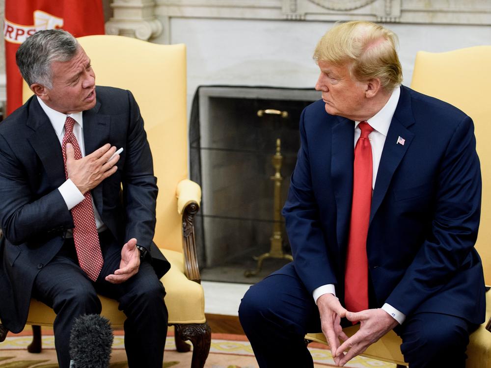 Jordan's King Abdullah II (L) speaks to U.S. President Donald Trump before a meeting in the Oval Office of the White House June 25, 2018 in Washington, DC.