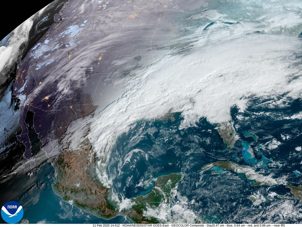 <strong>There's a country under here somewhere:</strong> A satellite image from early Tuesday shows a thick glaze of white clouds covering much of the continental U.S., with another storm system looming off the Pacific Coast.