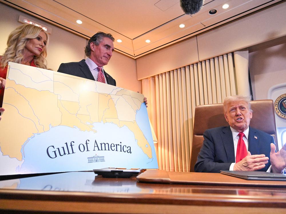 President Trump speaks to the press before signing a proclamation renaming the Gulf of Mexico as the Gulf of America aboard Air Force One en route to New Orleans, Louisiana, on Feb. 9, 2025.