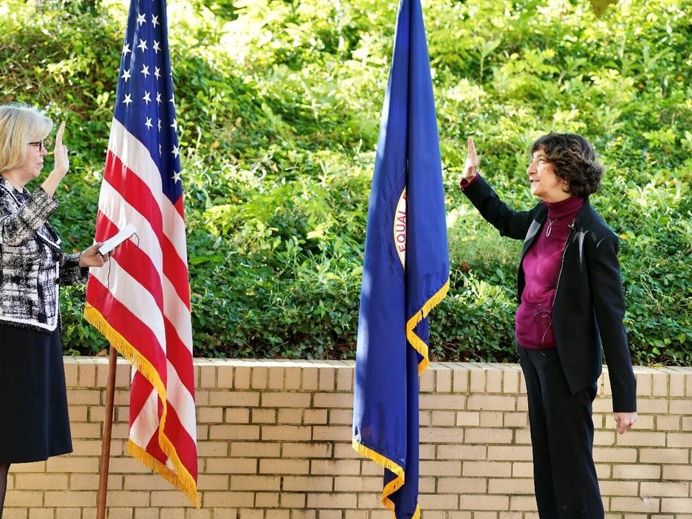 Former EEOC Commissioner Jocelyn Samuels, shown at right, President Trump's pick in his first term to fill a Democratic seat on the commission, is sworn in by then-EEOC Chair Janet Dhillon, left, on October 14, 2020.