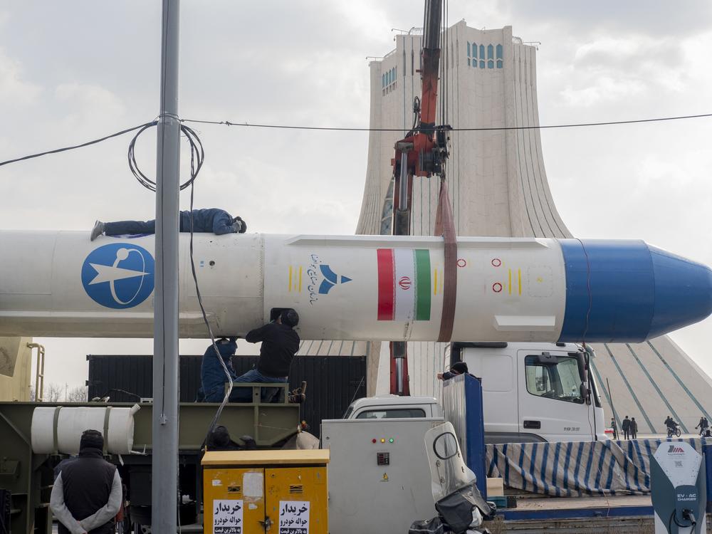 A large missile is displayed near the Azadi Tower in Tehran, Iran, on Monday. The event marked the 46th anniversary of Iran's 1979 Islamic Revolution. It comes at a time when Iran has suffered a series of setbacks. Iran's proxies in the region have been hard-hit, and Israeli airstrikes have significantly weakened Iran's air defenses.