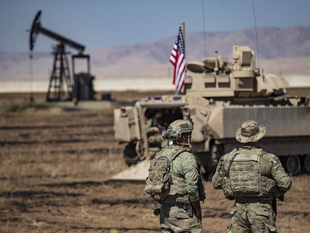 U.S. forces patrol oil fields in northeastern Syria in September 2024. The U.S. troops lead a coalition that defeated Islamic State forces in the region and have remained to prevent a resurgence of the extremist group. President Trump considered withdrawing the U.S. forces in his first term, but decided against it. He hasn't yet said what he intends to do in his second term.