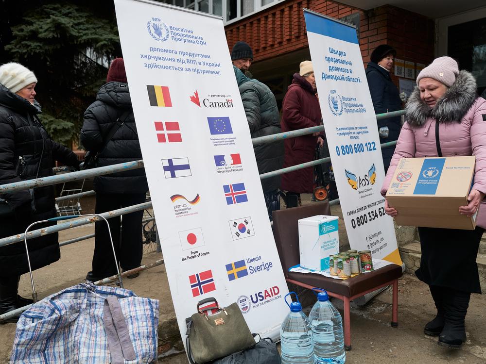 On Feb. 7, residents of Druzhkivka, Ukraine, received World Food Programme rations at a distribution point run by the Ukrainian charity Angels of Salvation. USAID is among the charity's funders.