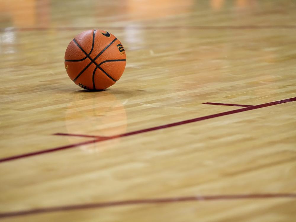 A basketball sits on the court during the first half of an NCAA college basketball game Jan. 21 in Ames, Iowa.
