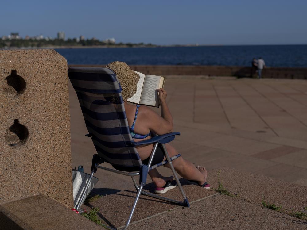 A woman sunbathes on a summer day in Montevideo, Uruguay, in January of 2025. This January was the hottest ever recorded on Earth.