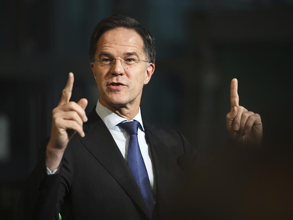 NATO Secretary-General Mark Rutte speaks with the media as he arrives for a meeting of NATO defense ministers at NATO headquarters in Brussels, Thursday.