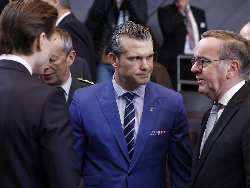 U.S. Defense Secretary Pete Hegseth (center) speaks with German Defense Minister Boris Pistorius (right) and Finland's defense minister, Antti Hakkanen, at NATO headquarters in Brussels, Thursday.