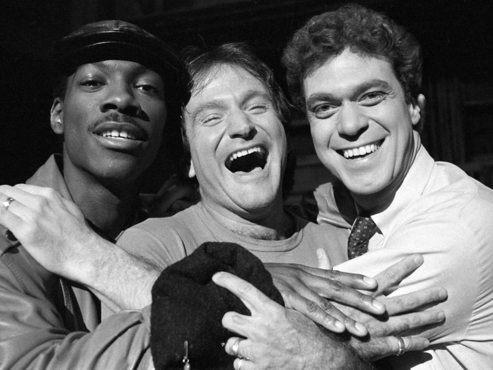 Eddie Murphy, left, guest host Robin Williams, and Joe Piscopo take a break from rehearsal in February 1984.