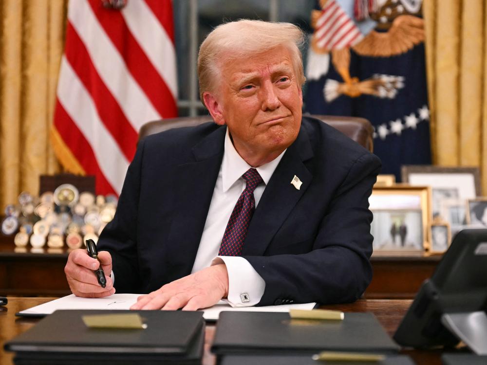President Trump signs executive orders in the Oval Office of the White House on Jan.20.