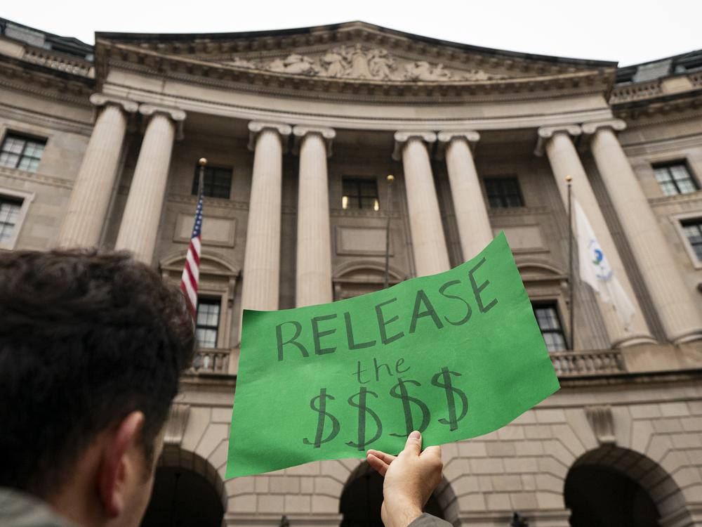 A demonstrator shows opposition during a demonstration at the Environmental Protection Agency on Feb. 6 in Washington, DC.