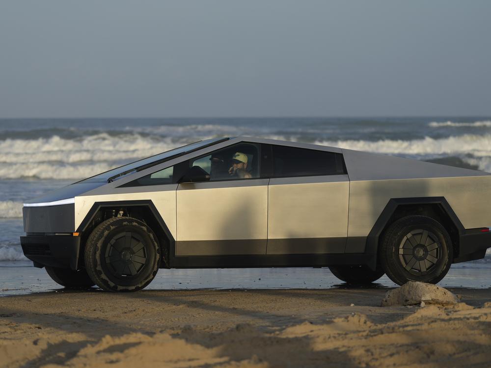 A Tesla Cybertruck moves along the beach in Boca Chica, Texas, on Nov. 18, 2024.