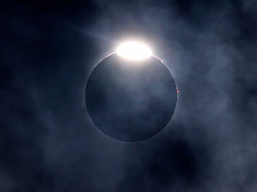 The diamond ring effect as well as Bailey's Beads are seen as the moon eclipses the sun on April 8, 2024, in Fort Worth, Texas.