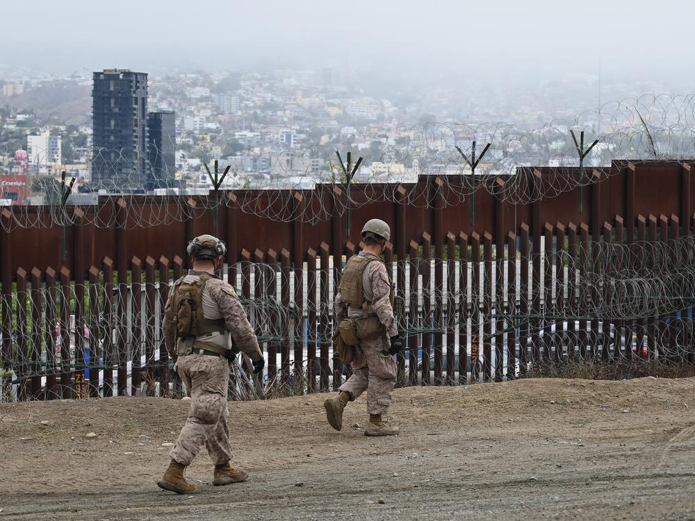 Members of the U.S. Marine Corps patrol the U.S.-Mexico border area as seen from San Diego on Feb. 7.