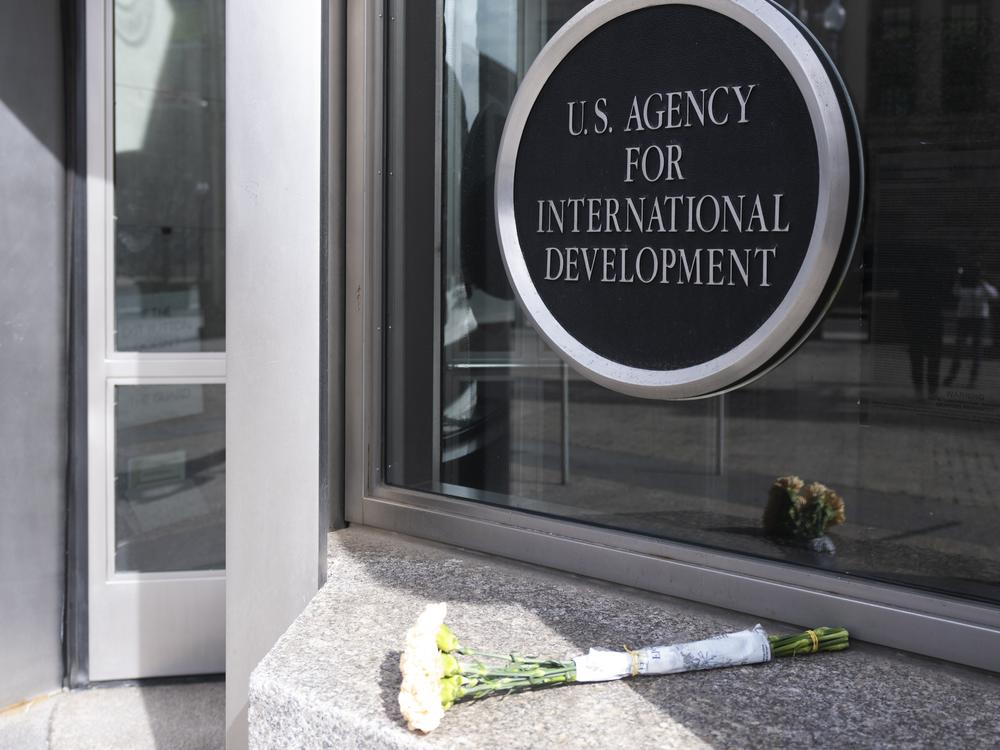 A bouquet of white flowers placed outside the headquarters of the United States Agency for International Development, or USAID, is pictured on Feb. 7, 2025, in Washington.