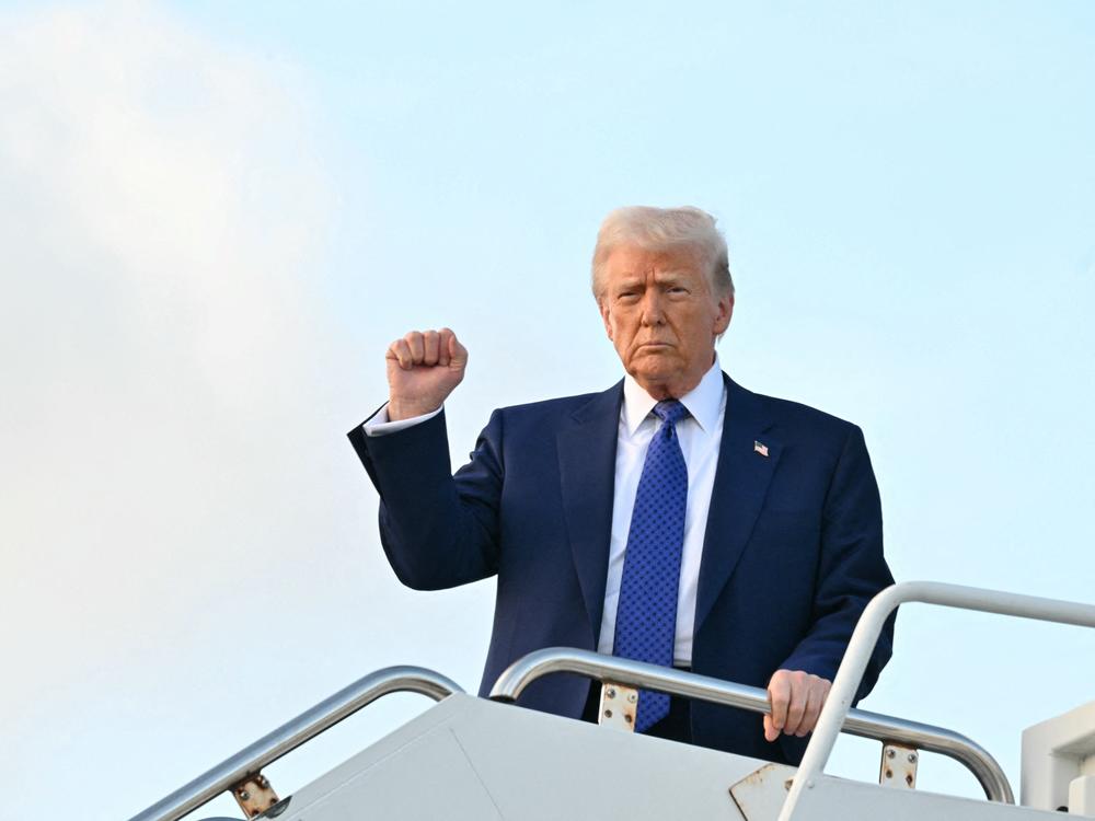 President Trump steps off of Air Force One at Palm Beach International Airport in West Palm Beach, Fla., on Feb. 14, 2025.