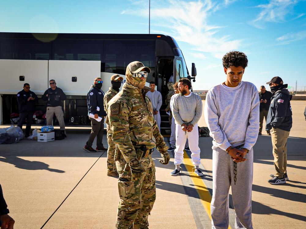 Sailors and Coast Guardsmen erect tents for a migrant holding facility in Guantánamo Bay, Cuba.  President Trump has directed the Pentagon and the Department of Homeland Security to prepare for 30,000 detained migrants.
