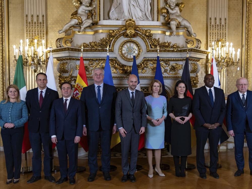 Leaders from Italy, Poland, Spain, Ukraine, France, Germany and the EU pose for a group photo during a meeting on European defense and Ukraine, at the Quai d'Orsay in Paris on Feb. 12.