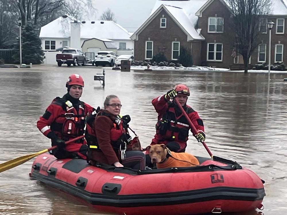 Clarksville Fire Rescue members perform water rescues to evacuate trapped people during flooding on Sunday in Clarksville, Tenn.