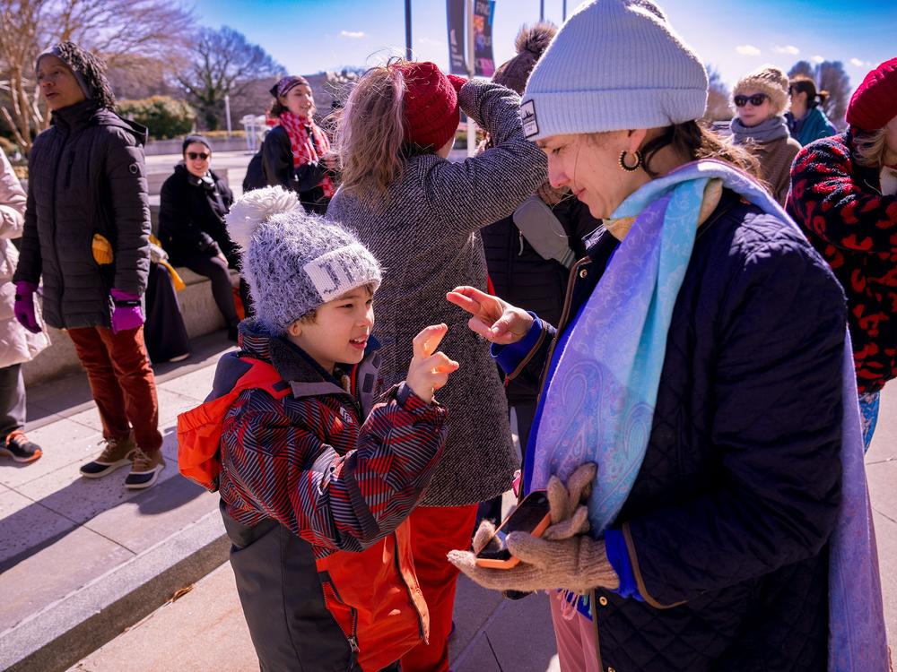 Performers gather outside of the Kennedy Center on Monday to protest new leadership. They're worried that the diversity of dance programming might be curtailed.