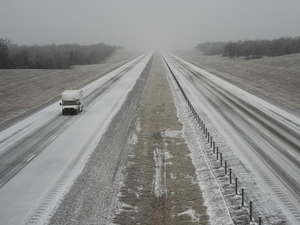 A truck drives along Interstate 335 during a winter storm, Tuesday, Feb. 18, 2025, near Luther, Okla.