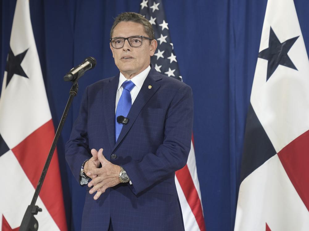 Panama's Minister of Public Security Frank Alexis Abrego, speaks to reporters after watching people board a repatriation flight bound for Colombia at Albrook Airport in Panama City on Feb. 3.