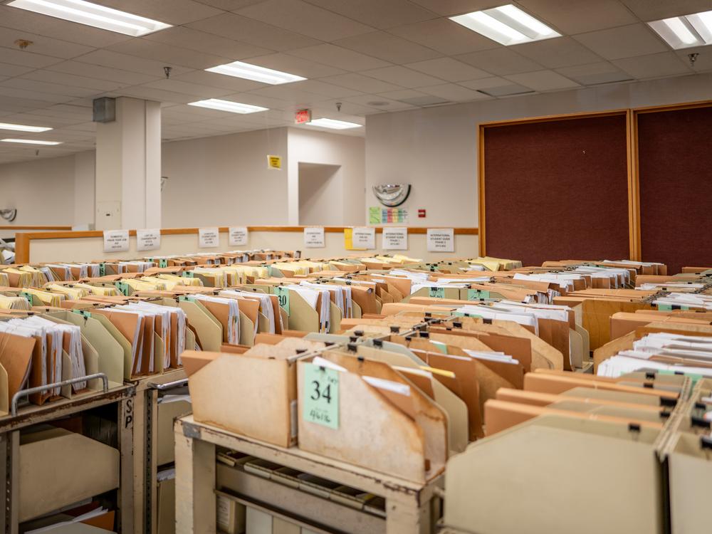 The IRS says it processed 11.7 million tax returns in the first week of the 2025 filing season. Here, carts loaded with documents are seen at an IRS processing facility in Austin, Texas, last September.