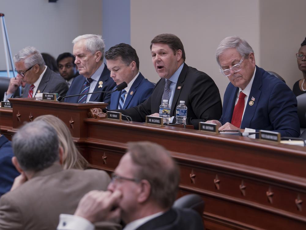 House Budget Committee Chairman Jodey Arrington, R-Texas, (center), flanked by Rep. Brendan Boyle, D-Pa., the ranking member (left), and Rep. Ralph Norman, R-S.C., (right). House Republicans work on a budget plan to advance President Trump's priorities, including $4.5 trillion in tax cuts, on Capitol Hill in Washington on Feb. 13.