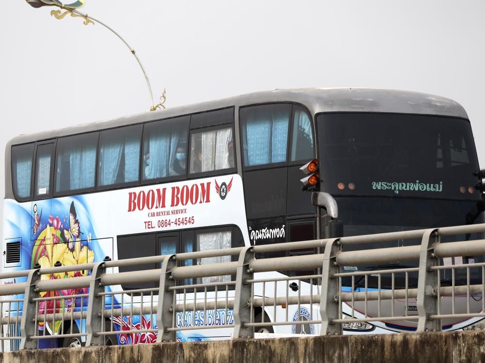 A bus, believed to be carrying Chinese nationals who have worked at scam centers in eastern Myanmar, crosses the 2nd Thai-Myanmar Friendship Bridge in Mae Sot in Thailand's Tak province before being flown back to China on Feb. 20, 2025.