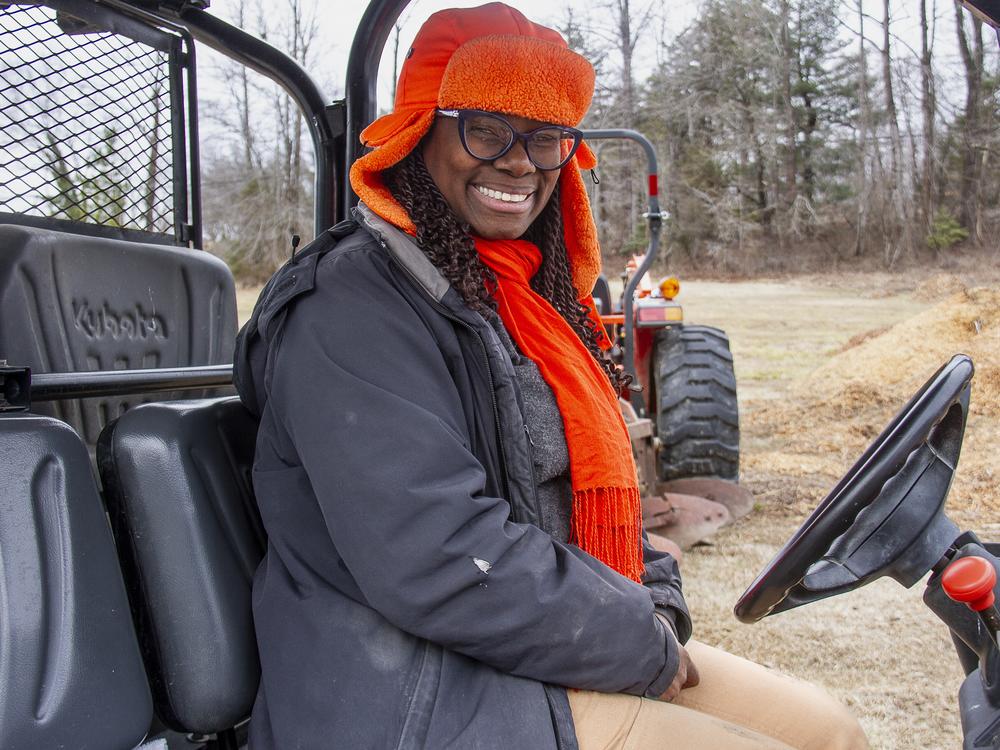 Farmer Gale Livingstone in a tractor at Deep Roots Farm in Upper Marlboro, Md.