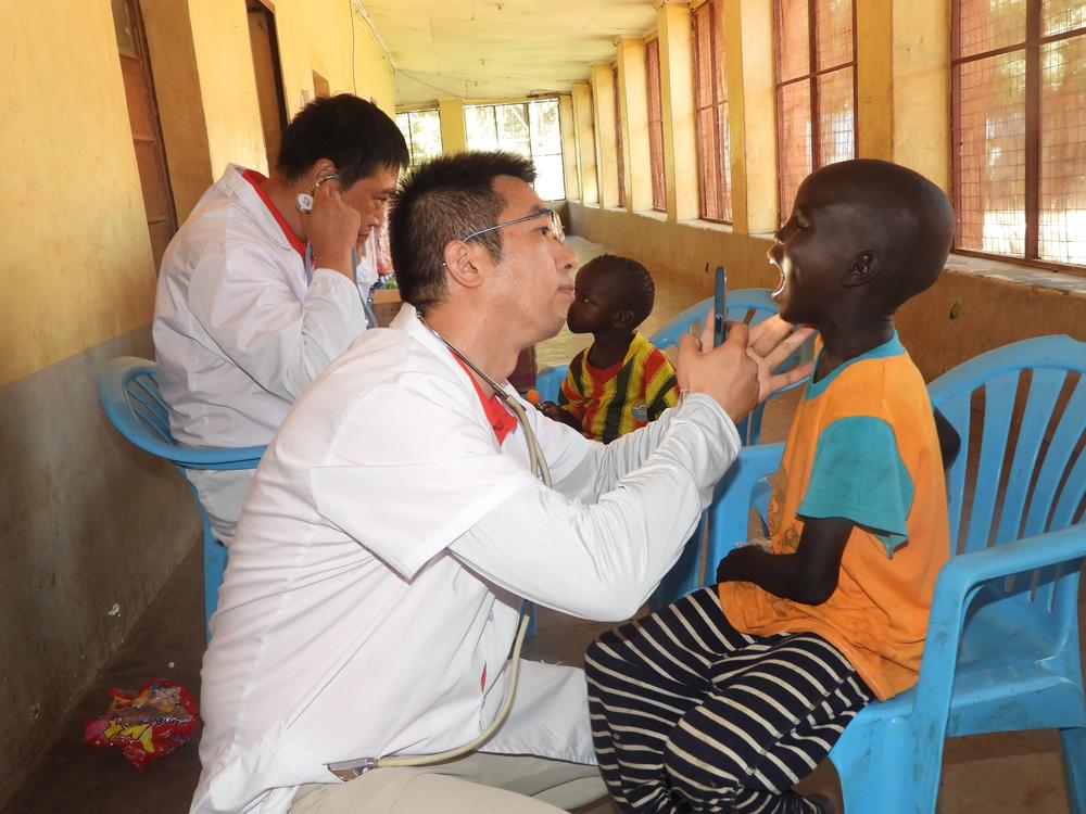 Doctors from a Chinese medical team examine children at the Juba Orphanage in South Sudan in September 2024 — part of China's effort to play a leading role in the world of global health.