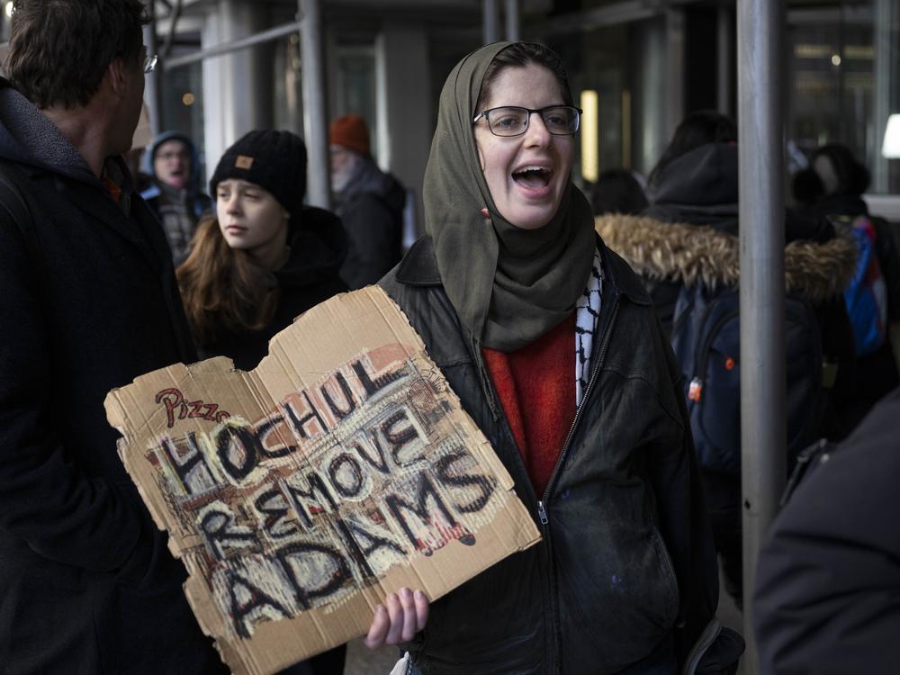 New Yorkers picketed to urge New York Governor Kathy Hochul to remove New York City Mayor Eric Adams as she met with top Democratic leaders to discuss Adam's fate in New York City on Feb. 18.