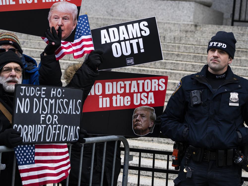 NEW YORK, NEW YORK - FEBRUARY 19: Protesters awaited the arrival of New York City Mayor Eric Adams to his court hearing at Thurgood Marshall Courthouse  in New York City. Judge Dale E. Ho scheduled a hearing in response to the Justice Department's request to dismiss corruption charges against Adams. The hearing comes after four deputy mayors from Adams' administration resigned over his cooperation with U.S. President Donald Trump on immigration, which prosecutors on his bribery case alleged was part of a d…