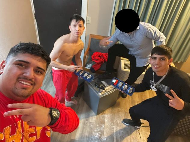 A photo from an FBI affidavit shows, from left, Pablo Zuniga Cartes, Ignacio Zuniga Cartes and Bastian Jimenez Freraut, along with an unidentified person whose face is redacted. The FBI says the image, procured from an iCloud account, was taken minutes after a Milwaukee Bucks player's home was burglarized.